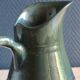 Vintage ceramic pitcher vase in glazed green and blue.
