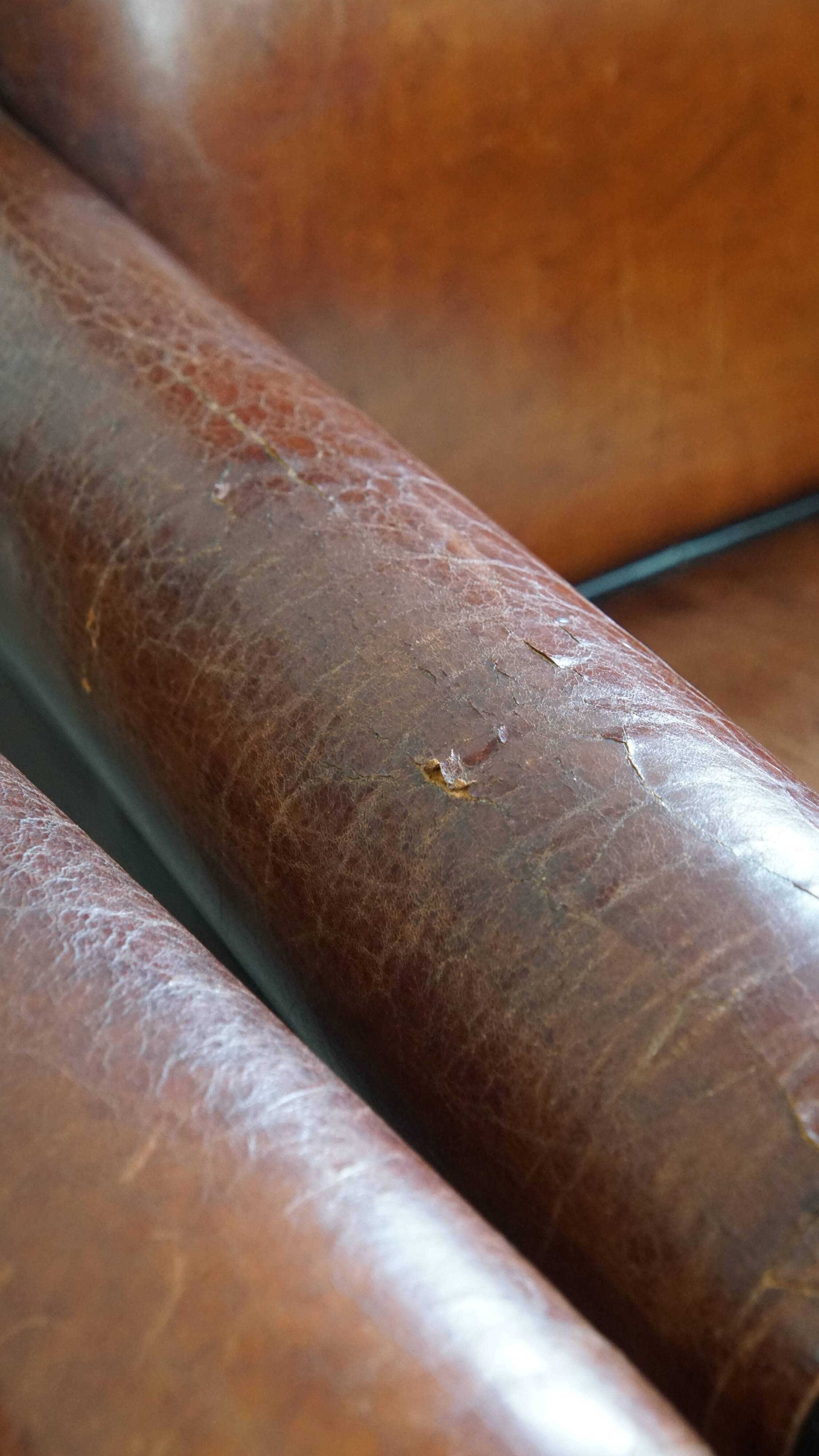 Vintage set of 4 sheepskin leather dining chairs on castors