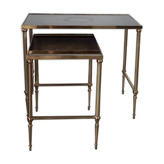 Pull out tables in bronze and eglomized glass