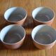 Lot of 4 bowls in sandstone and shiny grey inside