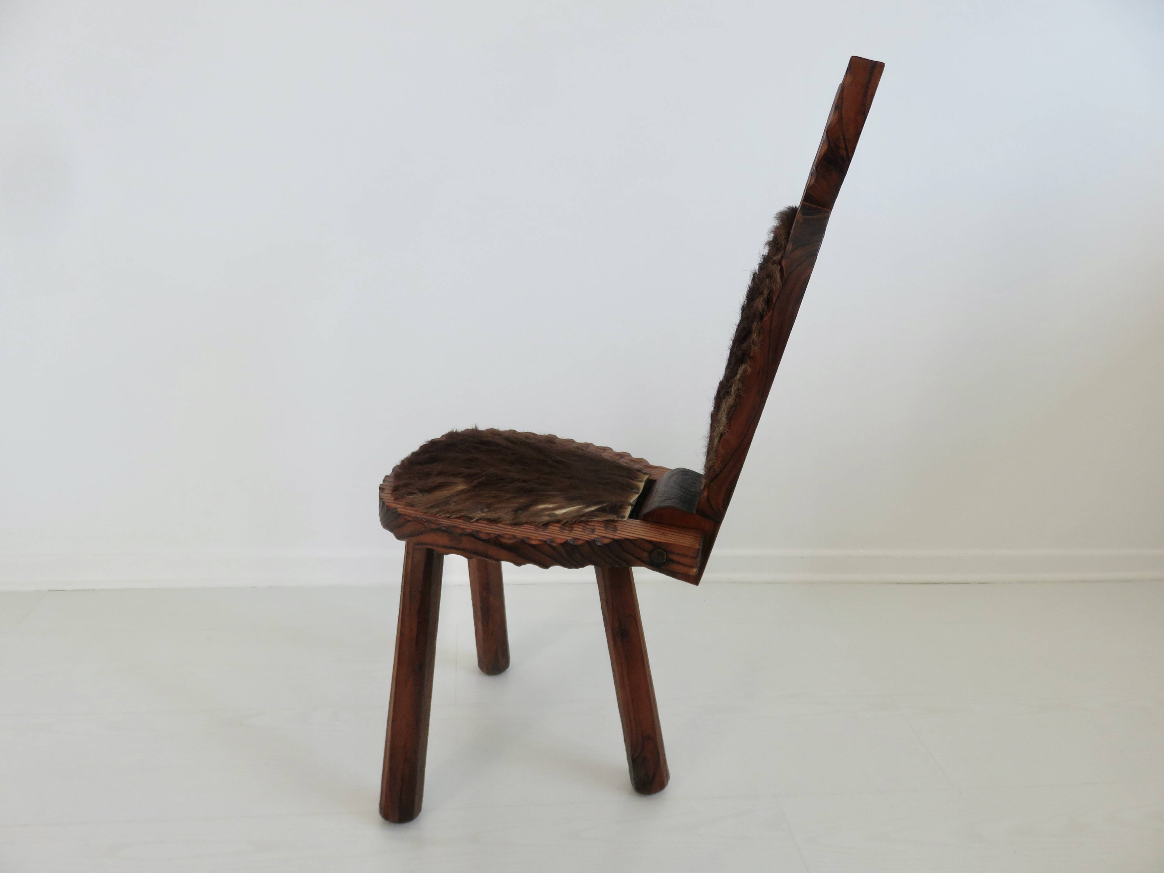 Brutalist cowhide tripod stool in solid wood