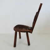 Brutalist cowhide tripod stool in solid wood