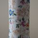 Table lamp for bedside use in earthenware with a wooden base.