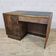 Art Deco desk in antique wood with shelf and archive drawers.