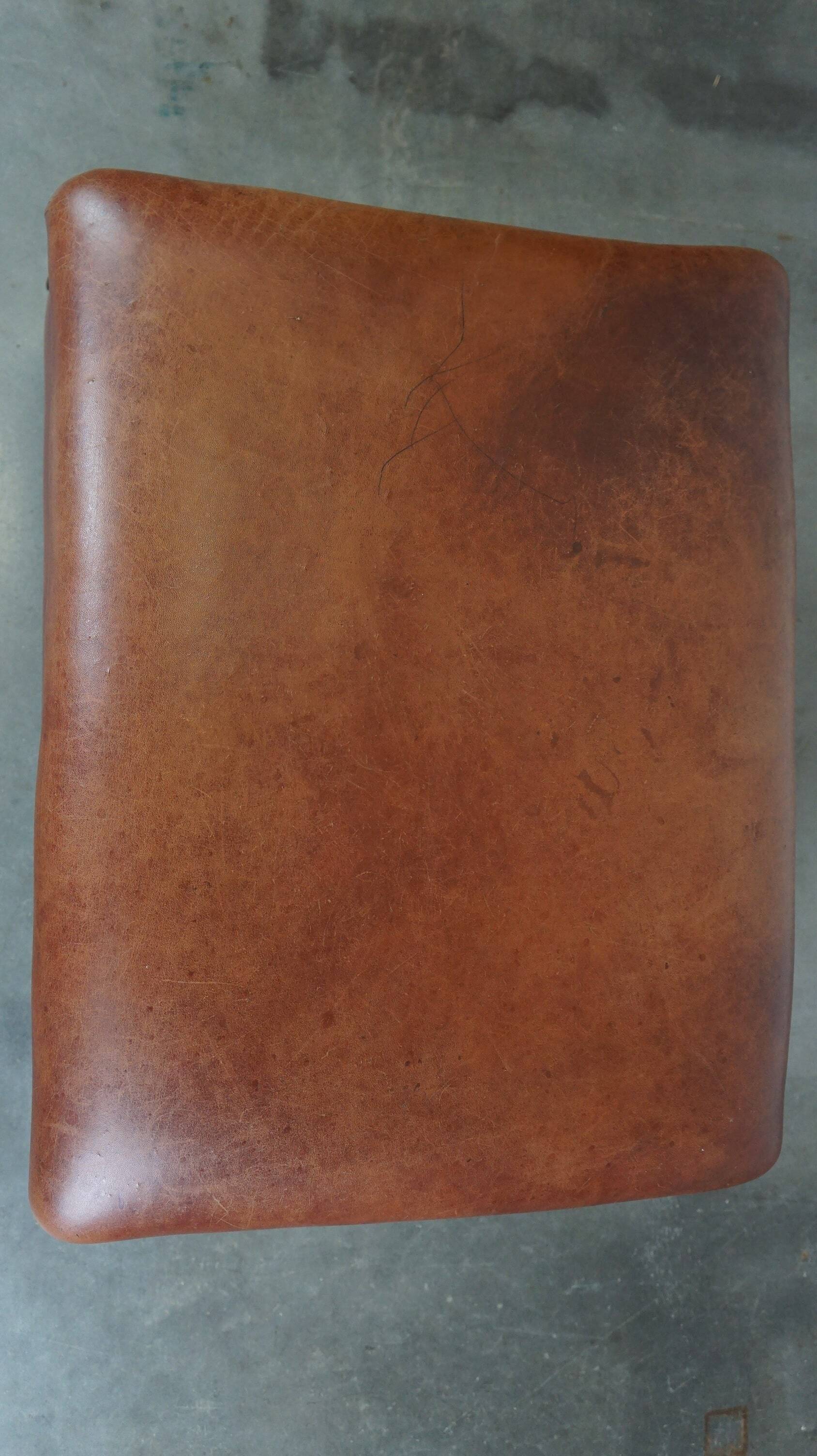 Leather ottoman in classic English style finished with decorative nails