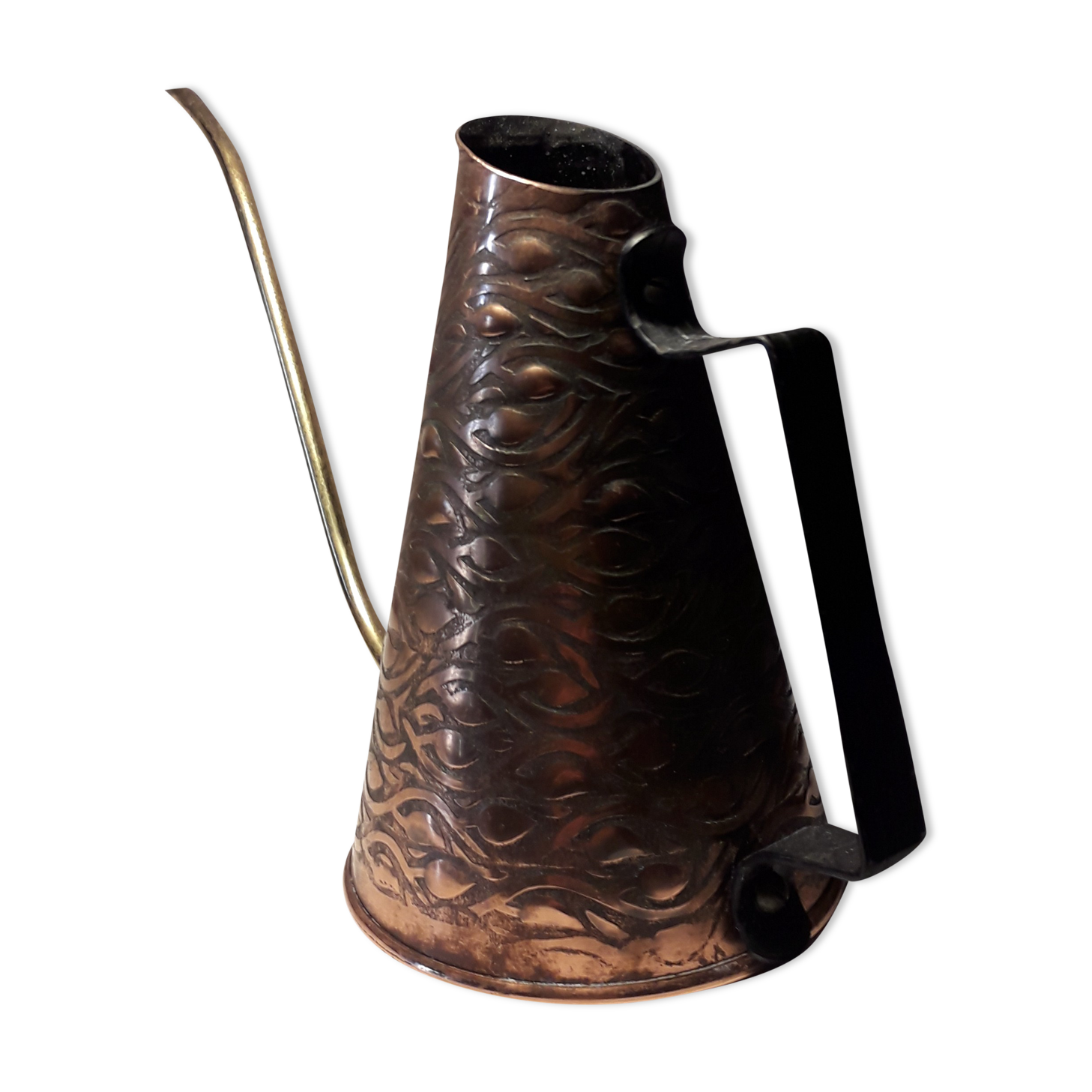 Old watering can in red copper and brass