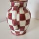 Old ceramic pitcher pattern checkerboard tiles