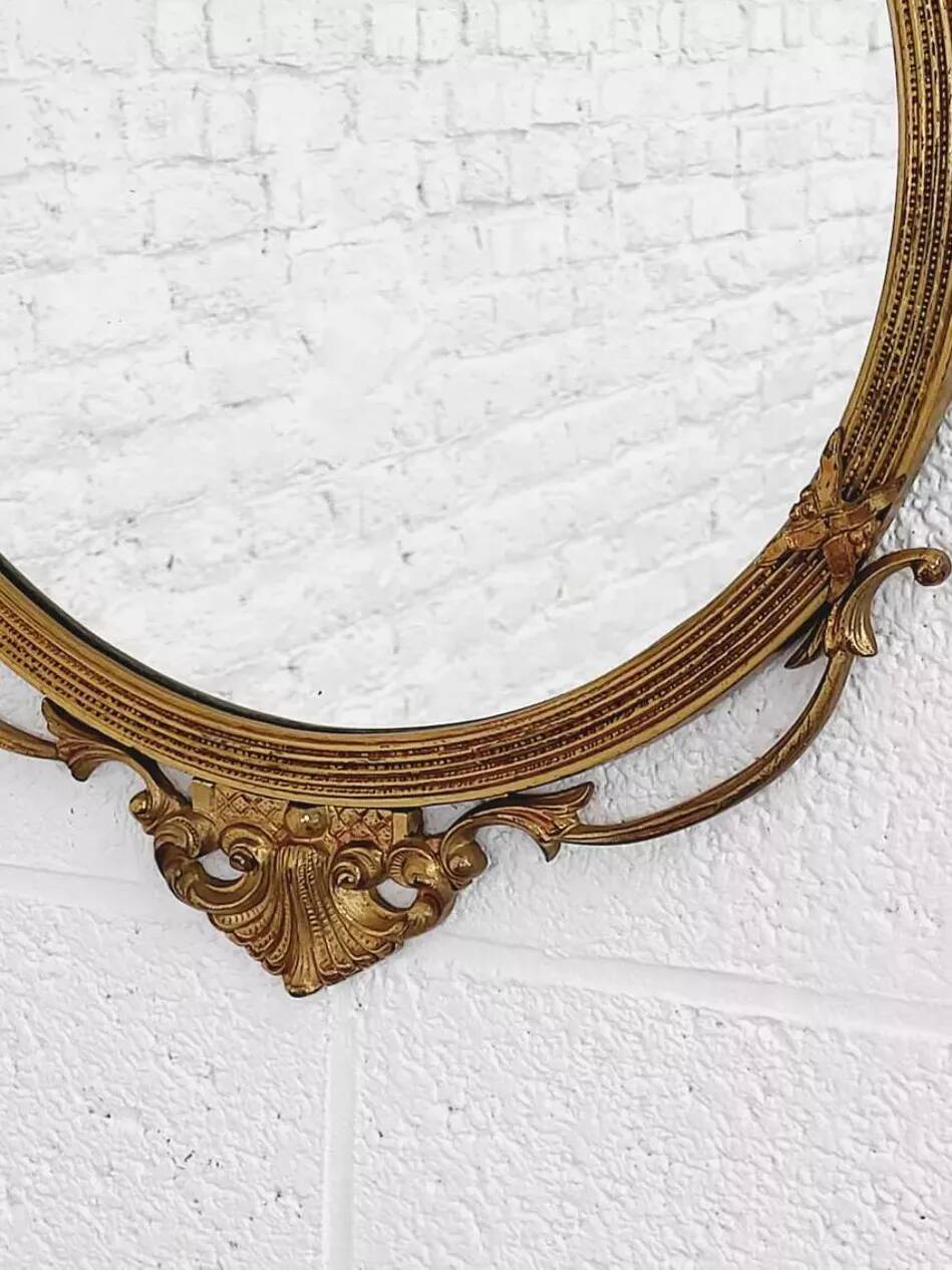Round brass medallion style mirror