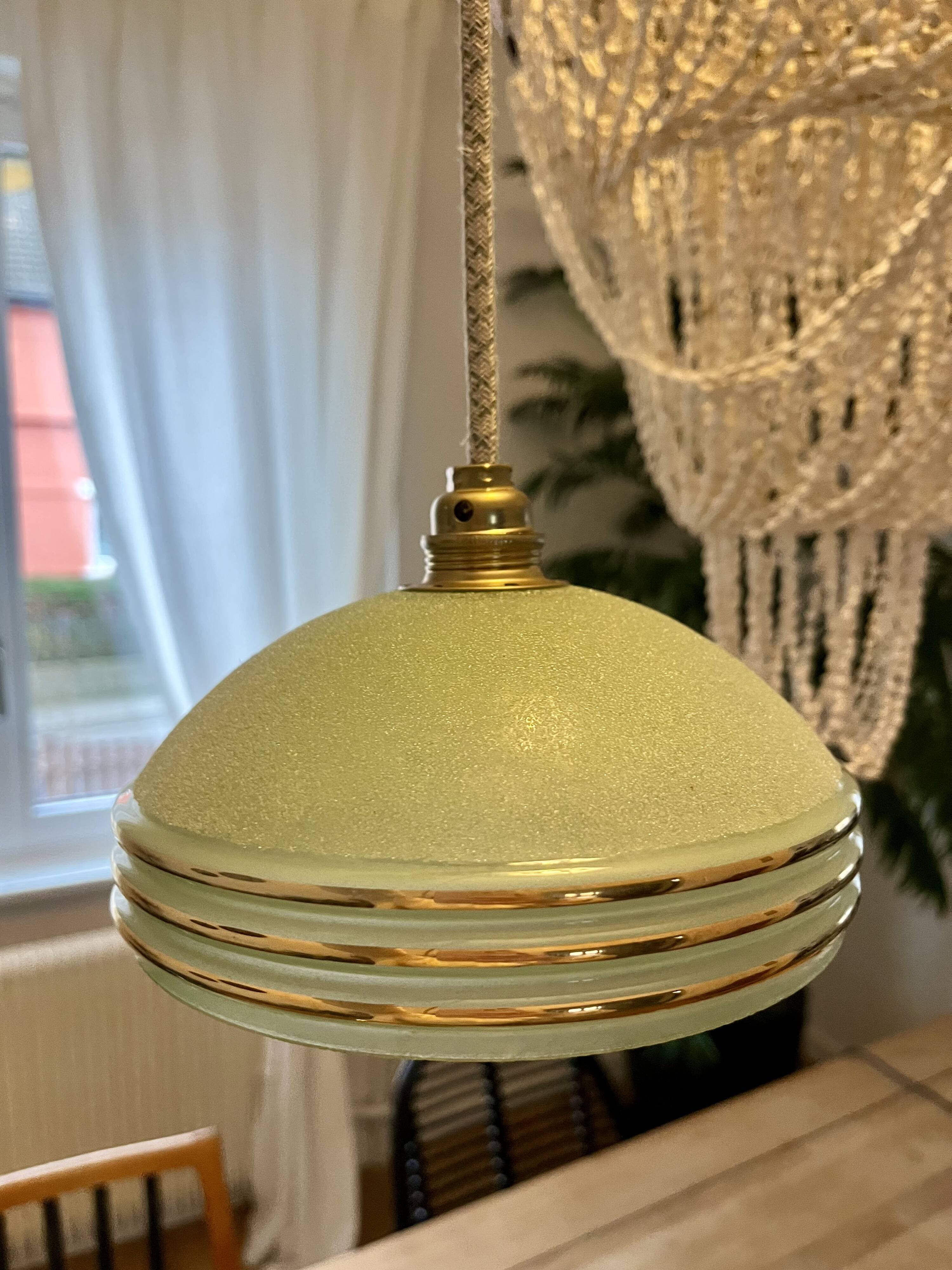 vintage Art Deco suspension in frosted almond green glass with golden trim