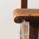 Antique armchair in walnut and studded leather, 17th century