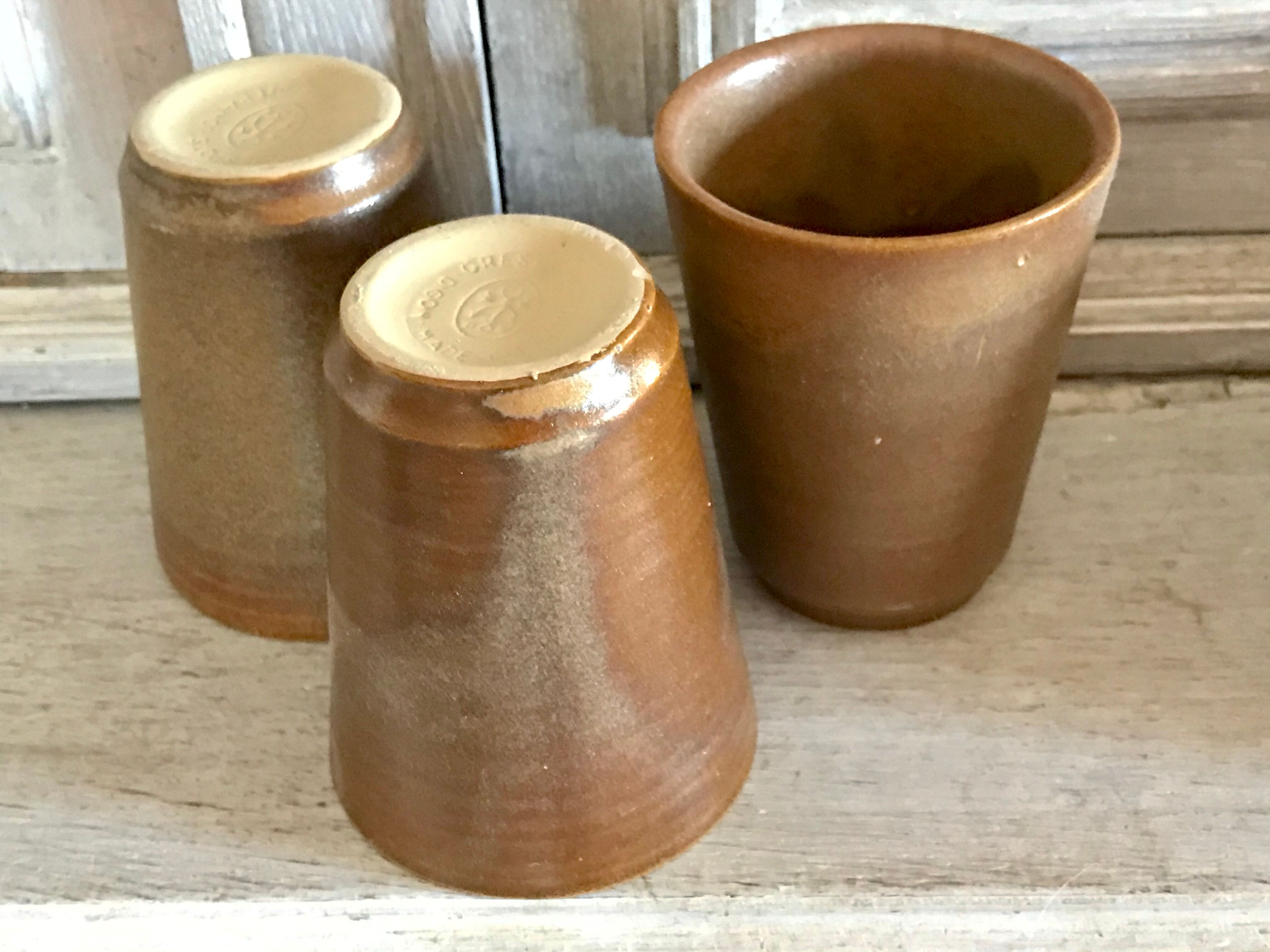 Lot of six Digoin mugs in sandstone