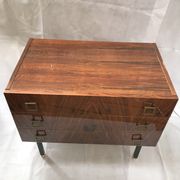 Lacquered 3-drawer chest with rosewood veneer.