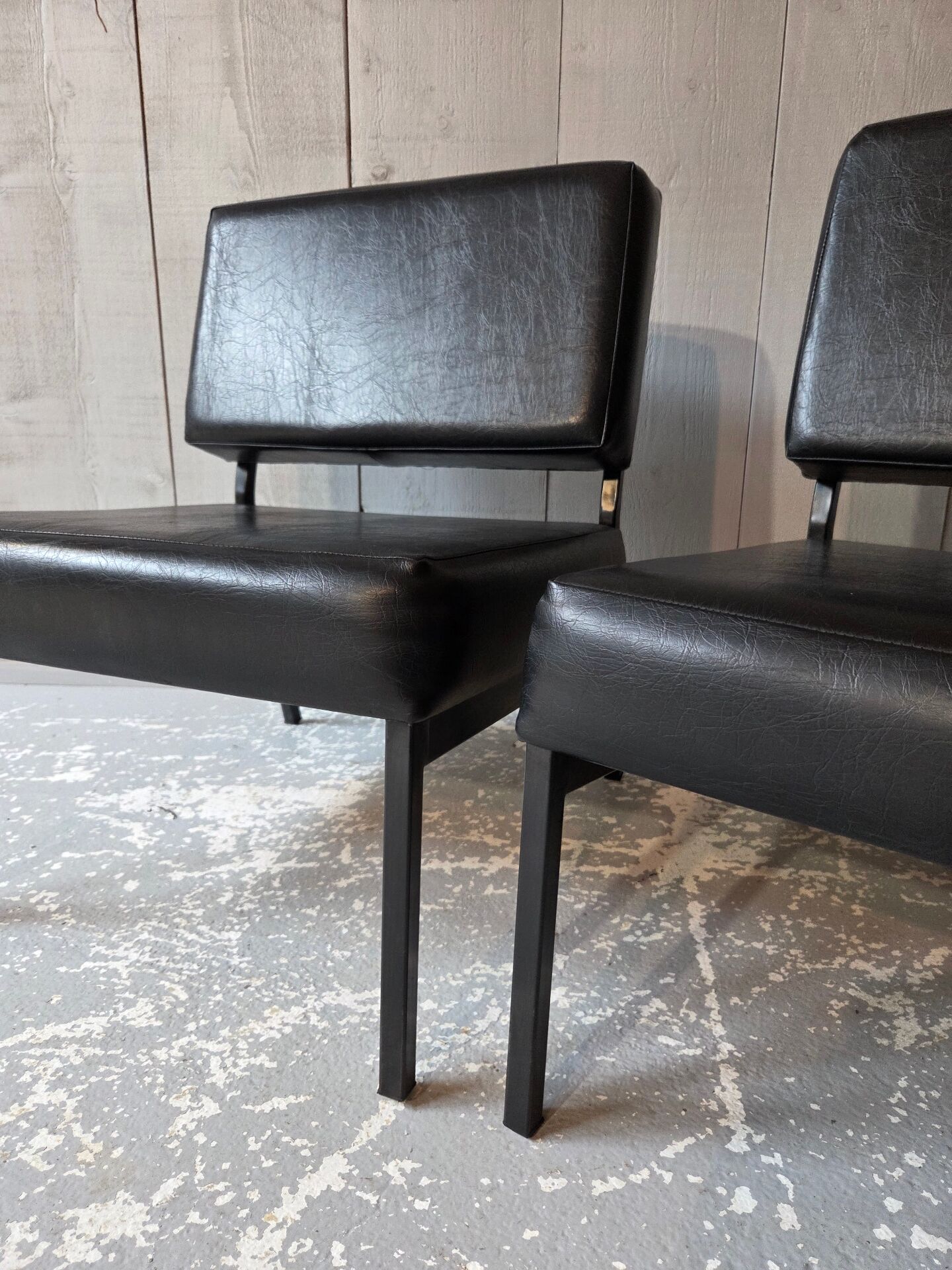 2 faux leather armchairs