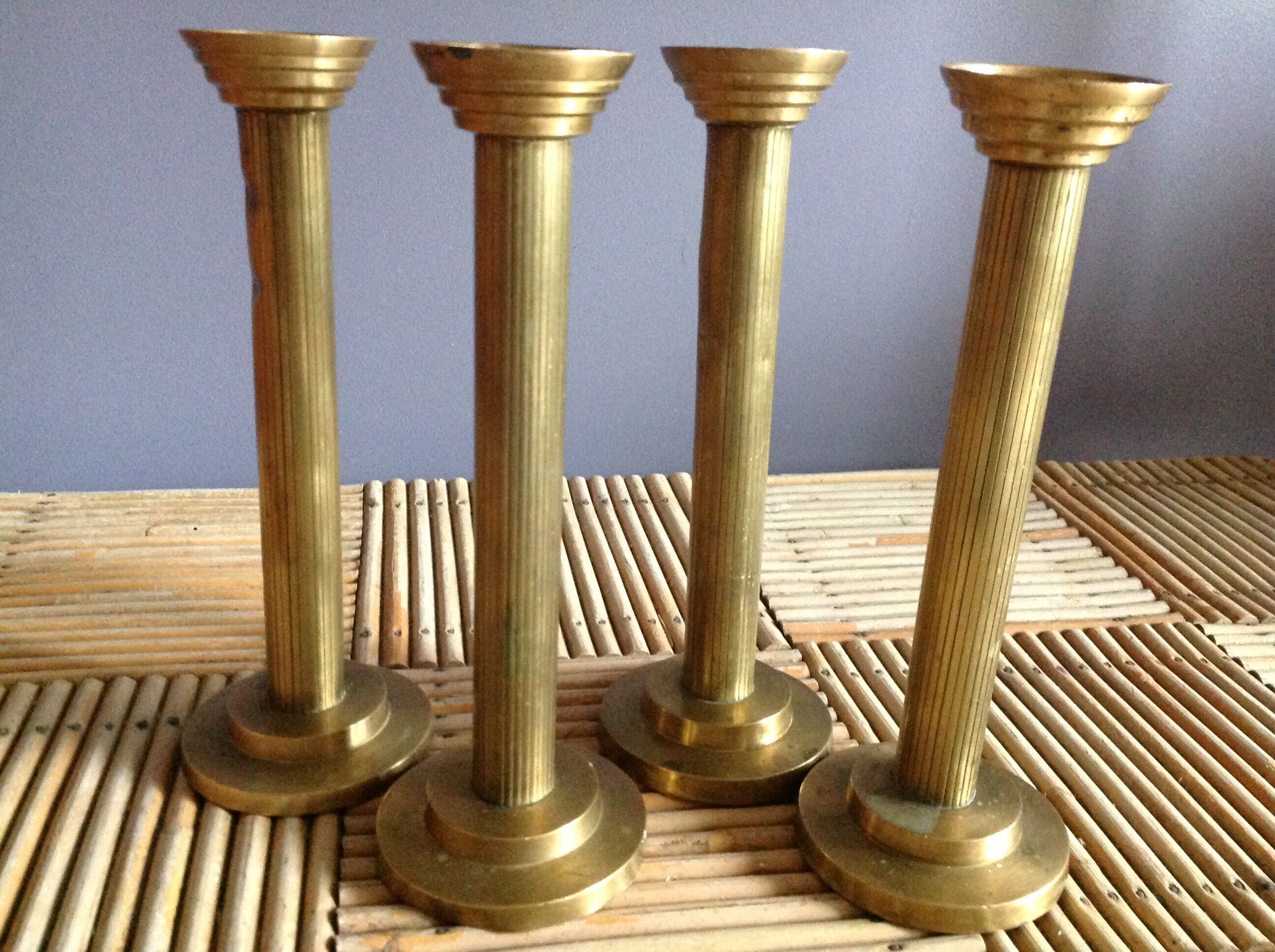 Series of 4 brass candlesticks
