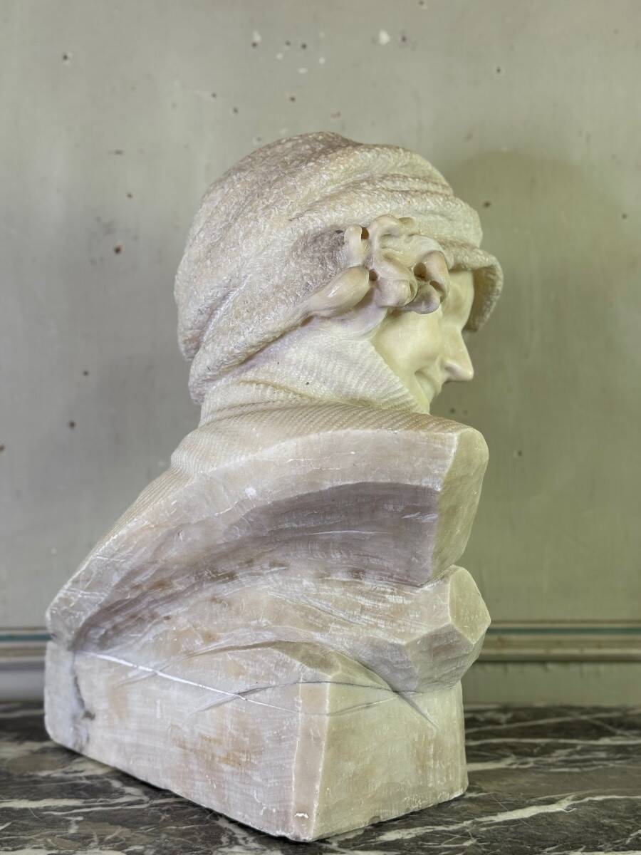 Alabaster bust of a young girl with a turtleneck, signed Caloni, Italy circa 1900