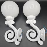Pair of white enameled cast iron wall sconces, mid-20th century