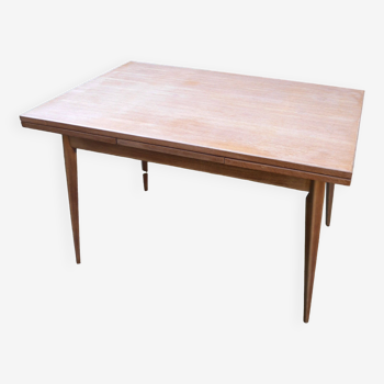 wooden dining table with compass legs and extensions