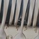 12 Christofle Versailles model cake forks in silver-plated metal.