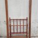 Child's bed or vintage rest bed made of solid cherry wood in a bamboo style.