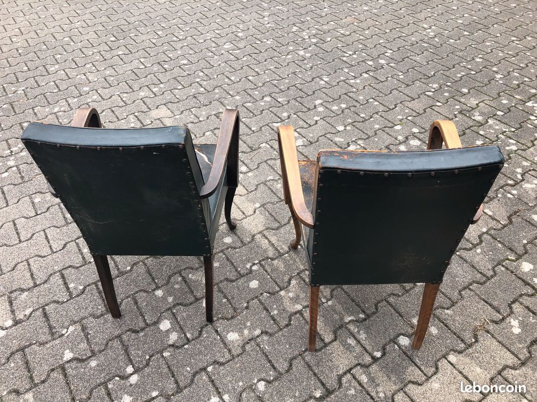 2 Dark green vintage wood and leather armchairs