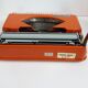 Hermes Baby orange typewriter