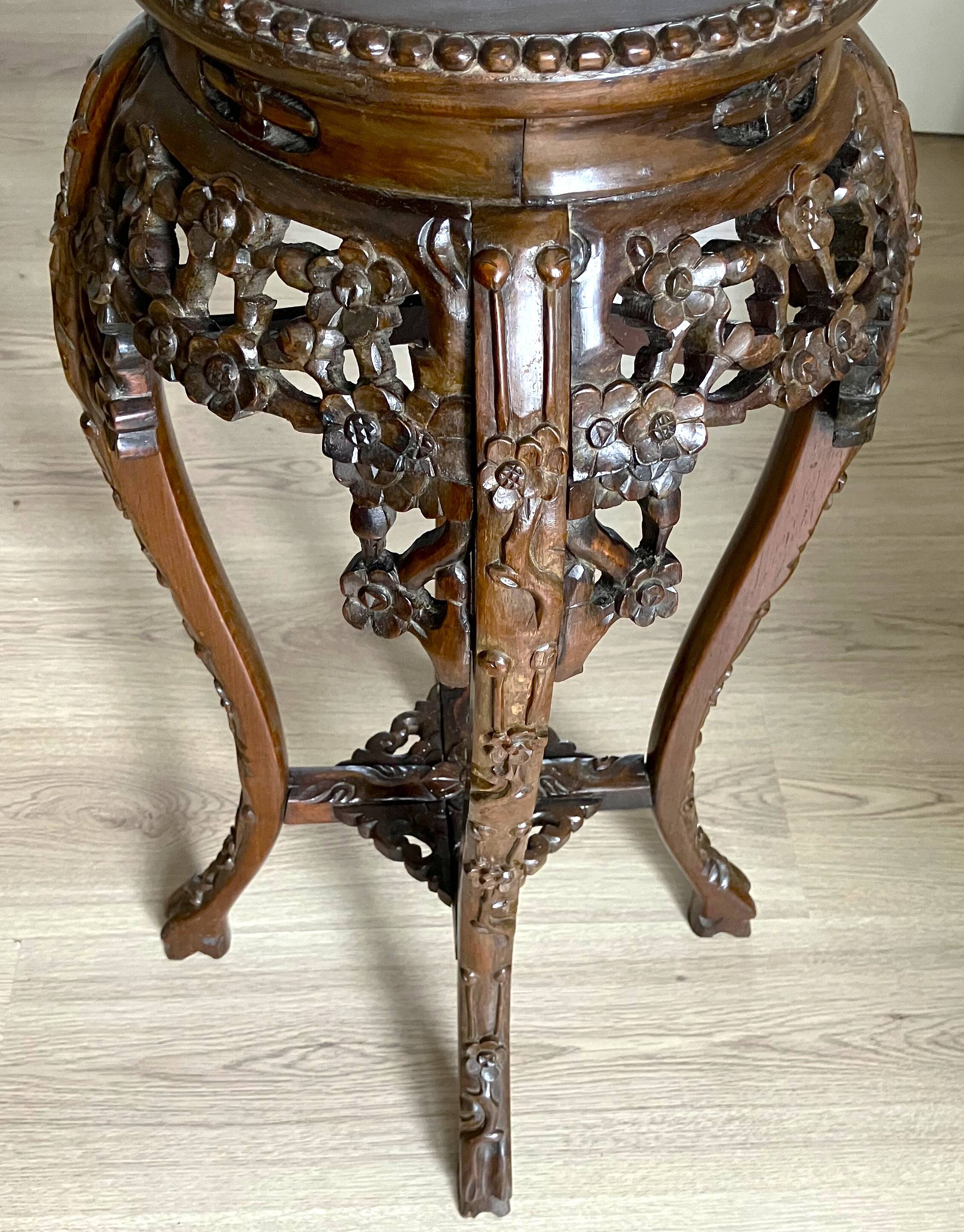 Chinese stool from the 19th century, made of wood and marble. In very good condition.