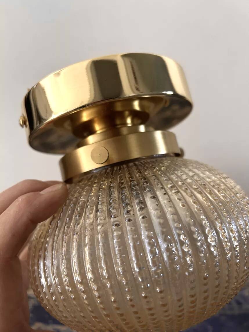 Golden globe wall light
