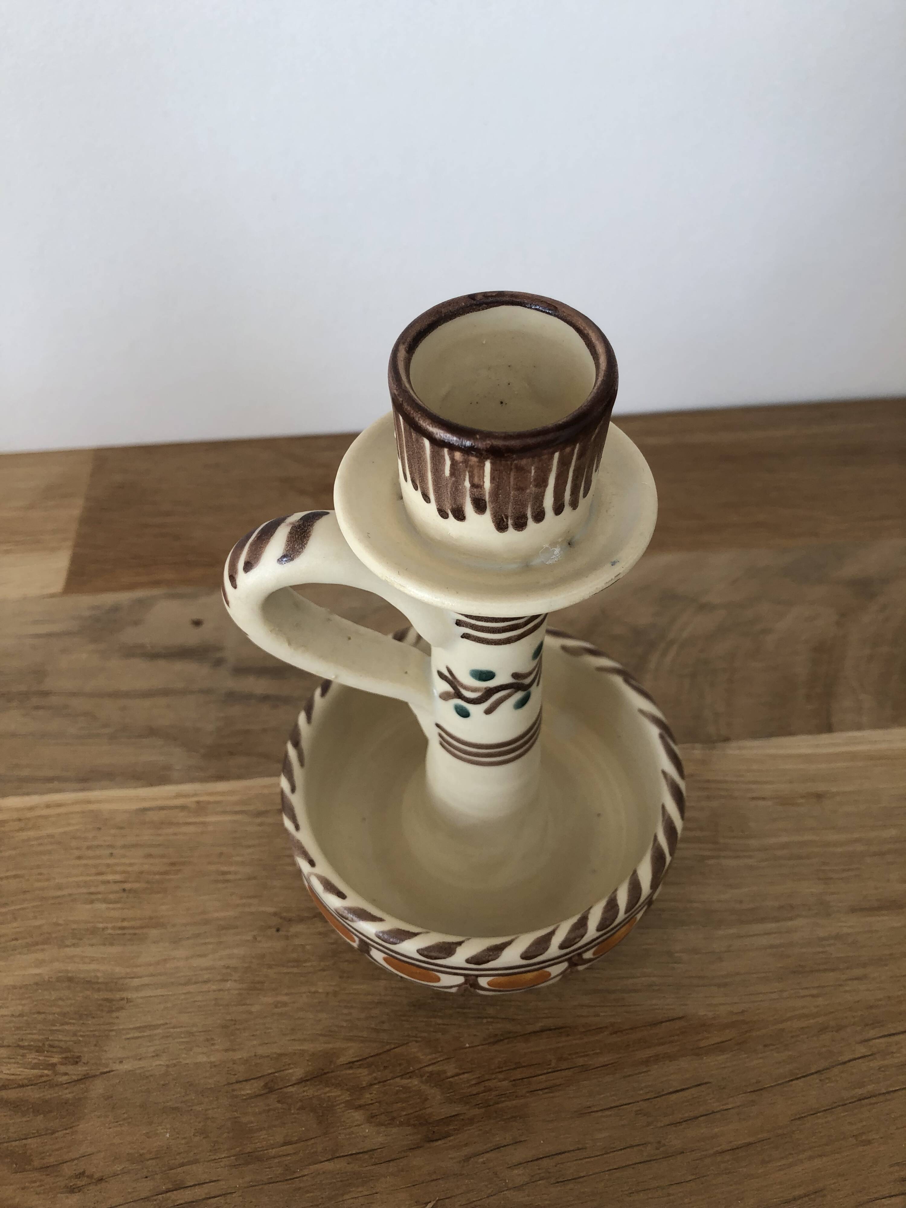 Set of two candlesticks/candle holders in orange and brown tones