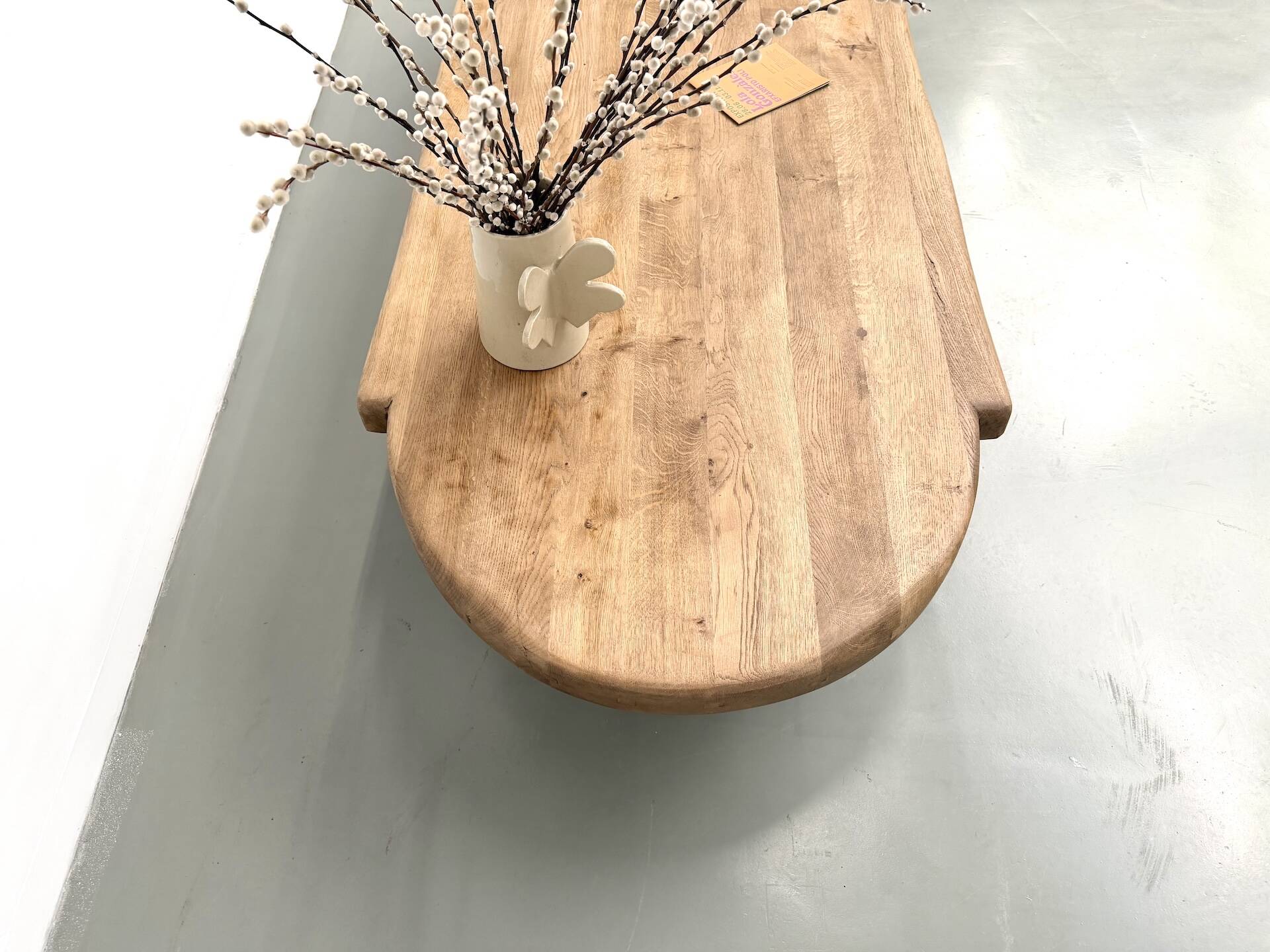 XXL oval coffee table in solid oak, cylindrical base, 1950s.