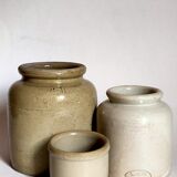 Set of three pots with old condiments in glazed earth
