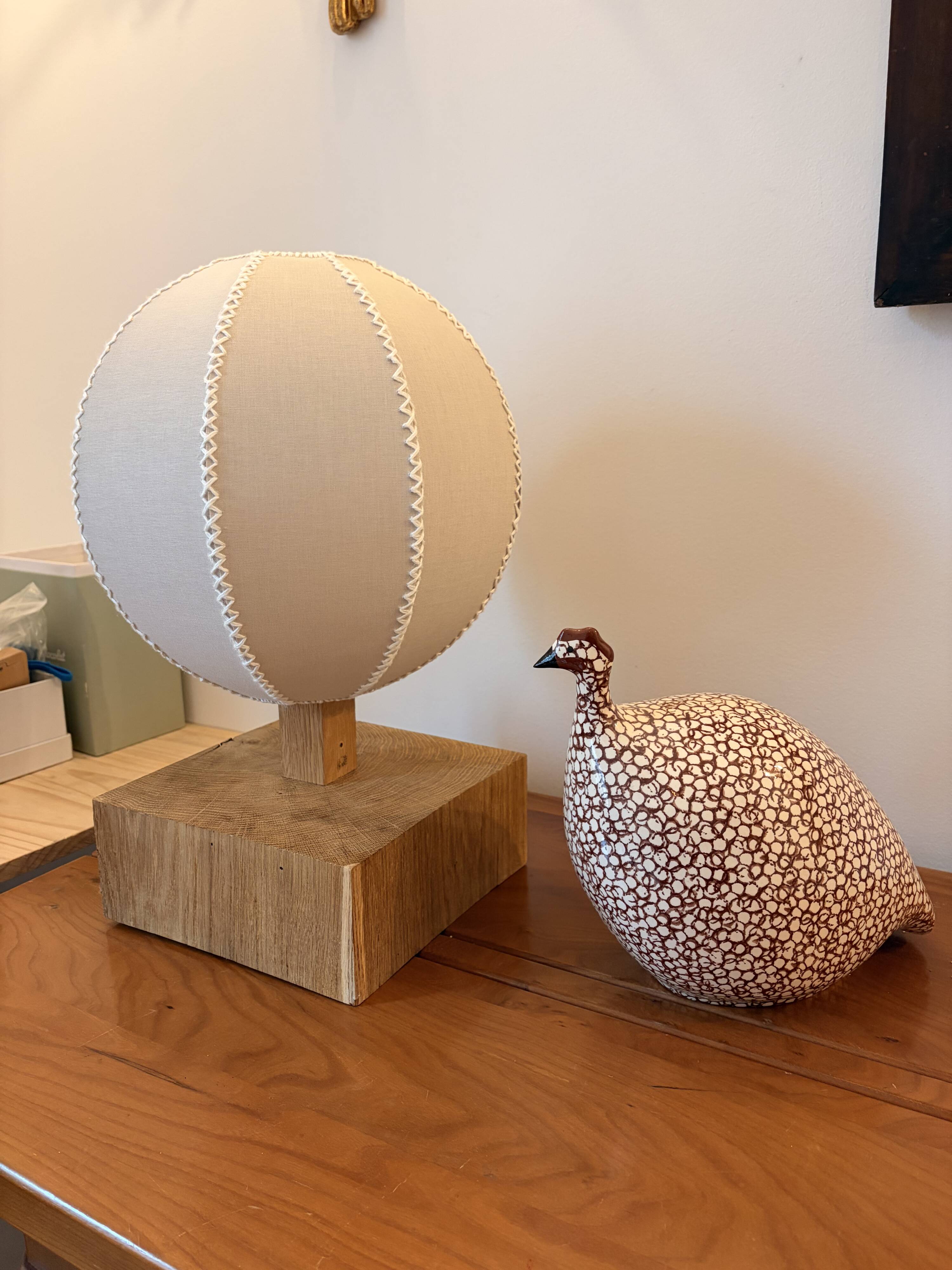 Handmade wooden ball lamp on a stand