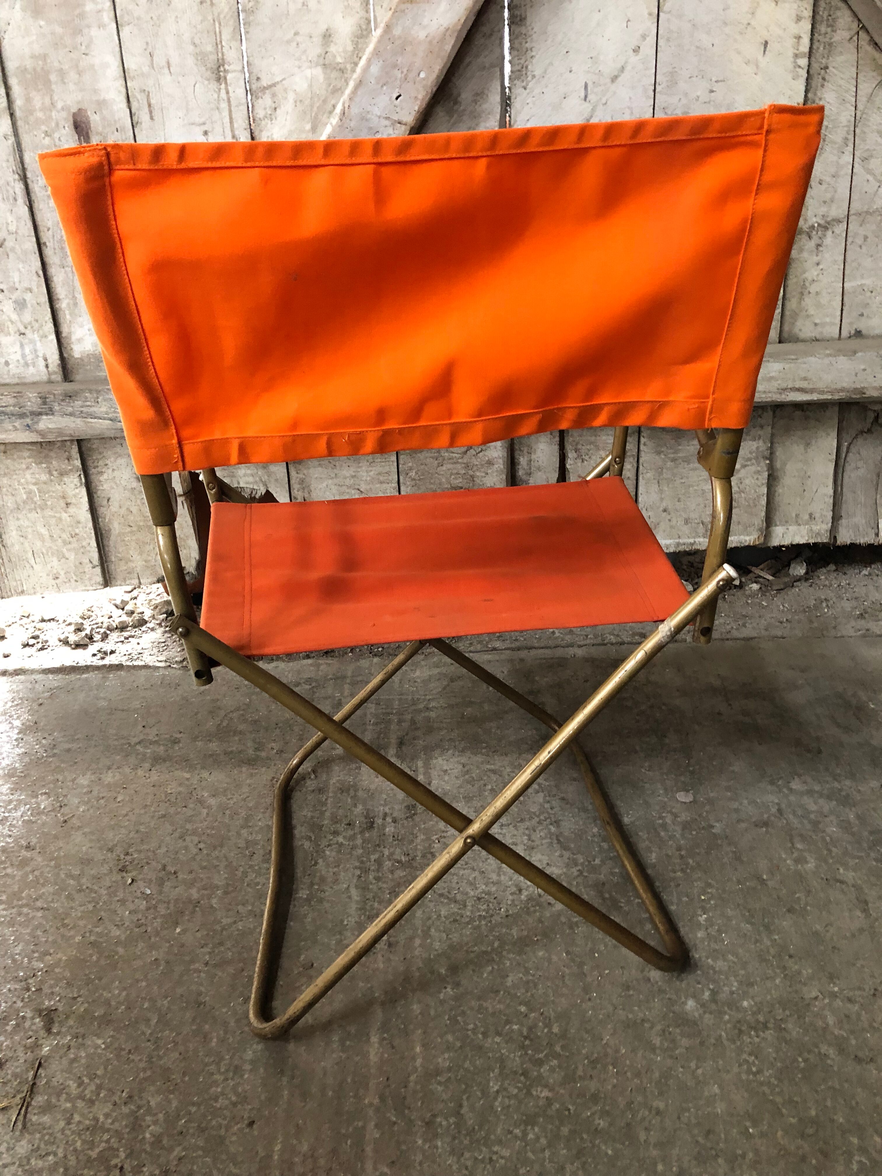 Fauteuil pliant tube métal noir avec tissu orange années 70 vintage