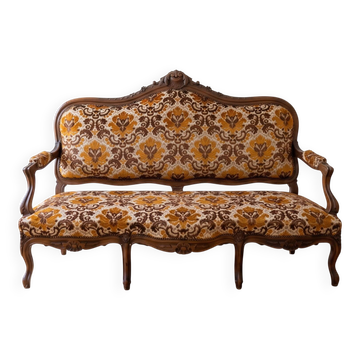 Two-seater banquette canapé in Louis XV style, made of wood and fabric.
