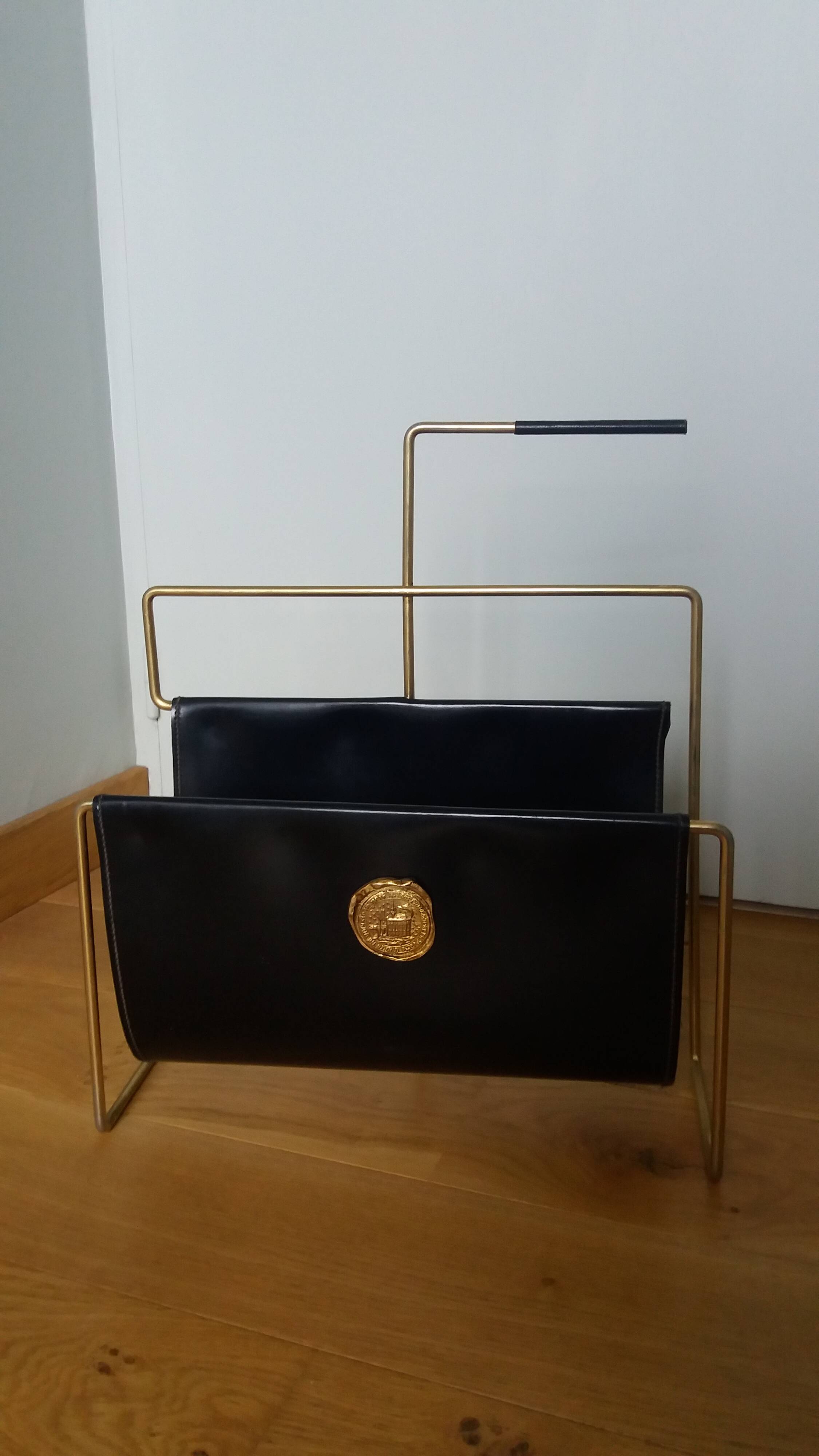 Modernist magazine rack in the style of Jacques Adnet