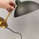 A wall lamp in black and brass-coloured finishes. Danish, early 2000s.