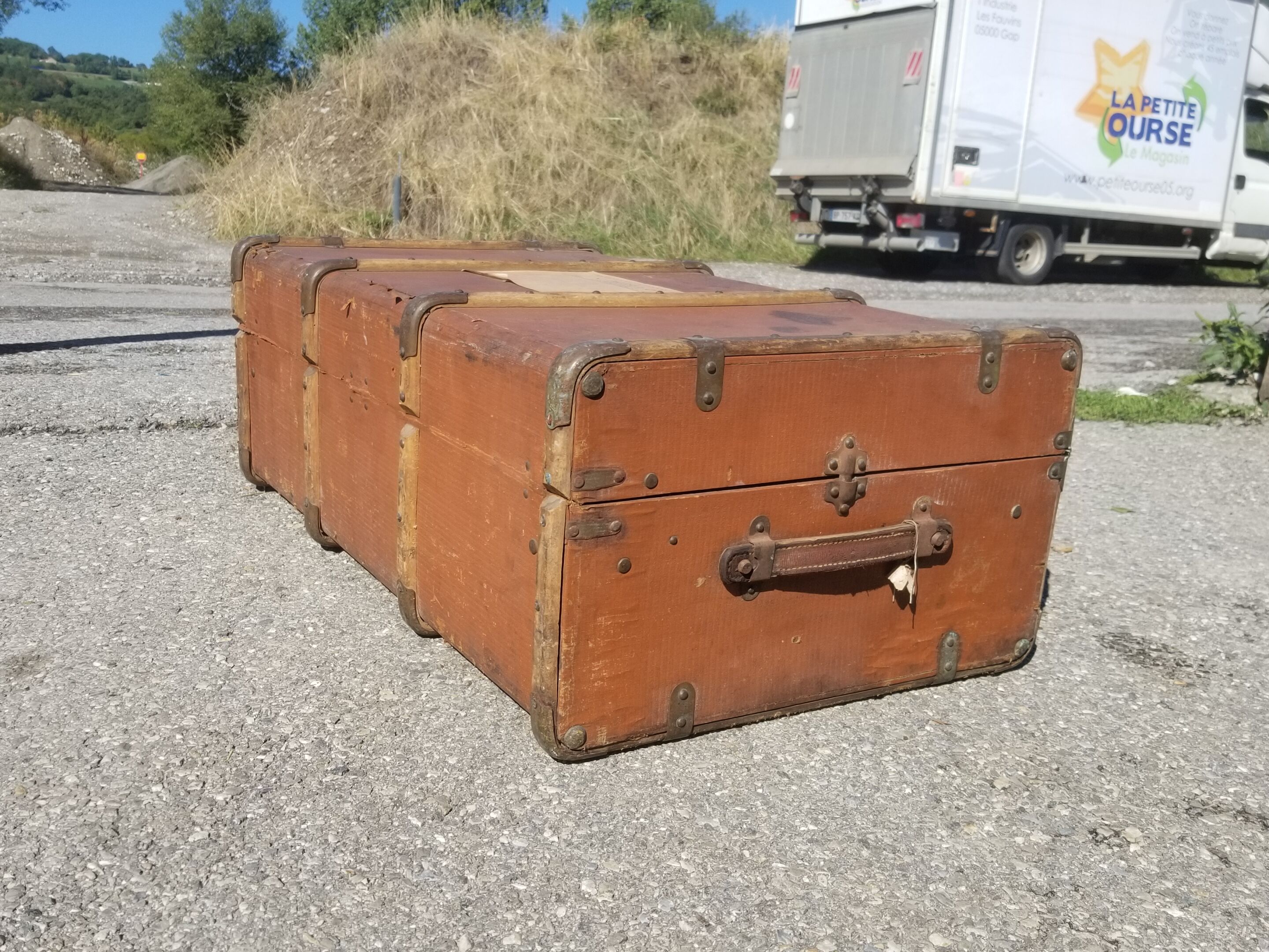 Old travel trunk made of wood and brass