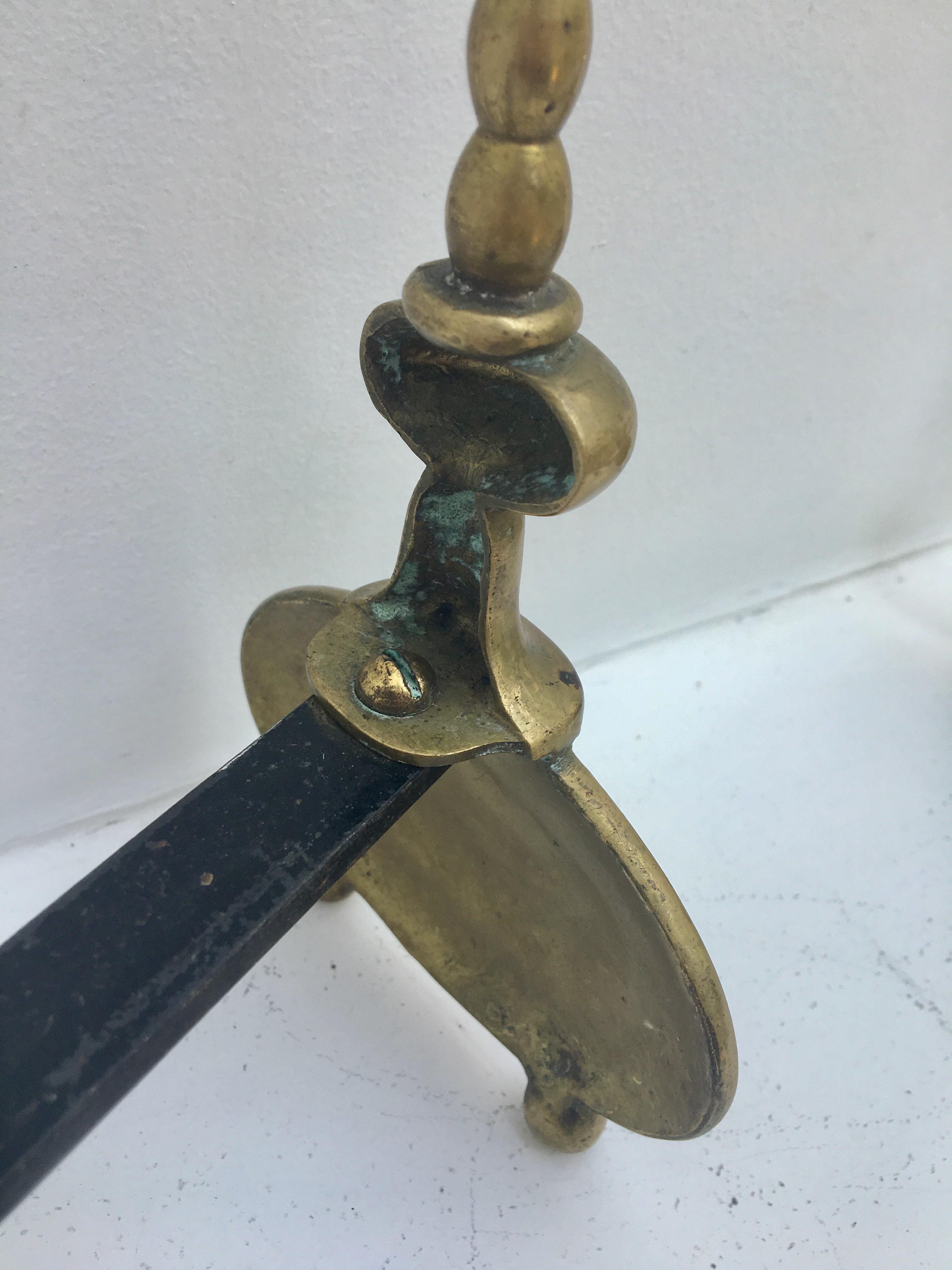 Pair of andirons in brass for fireplace