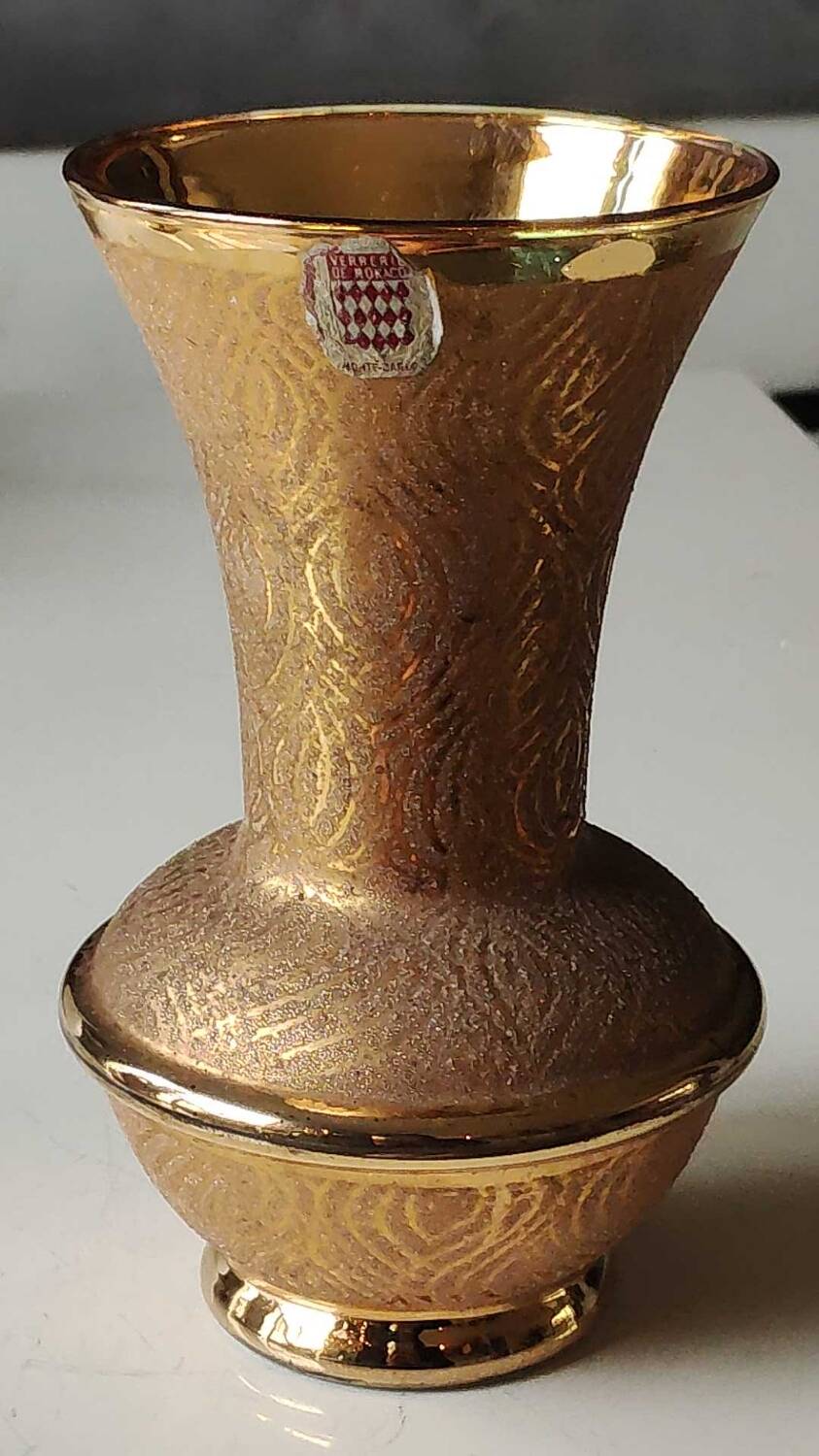 Ball vase stamped Verrerie de Monaco/Monte Carlo. In gold granite glass