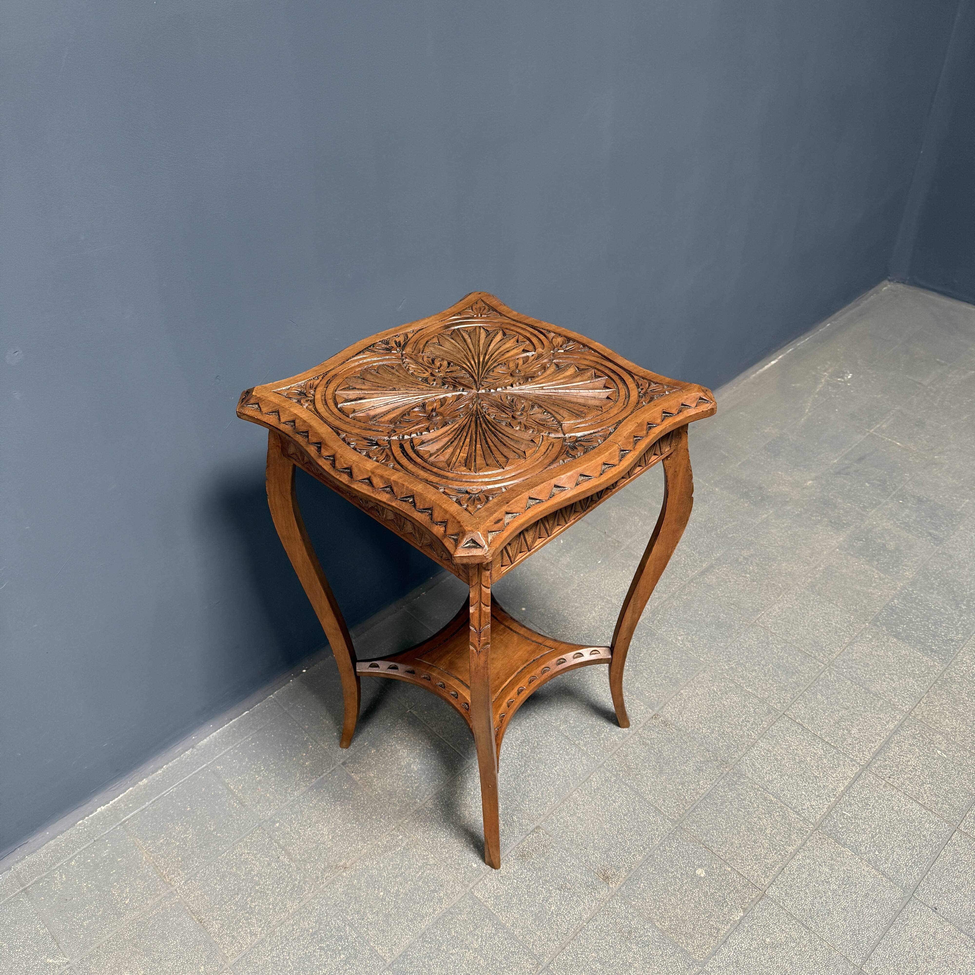 Graceful antique carved wooden side table