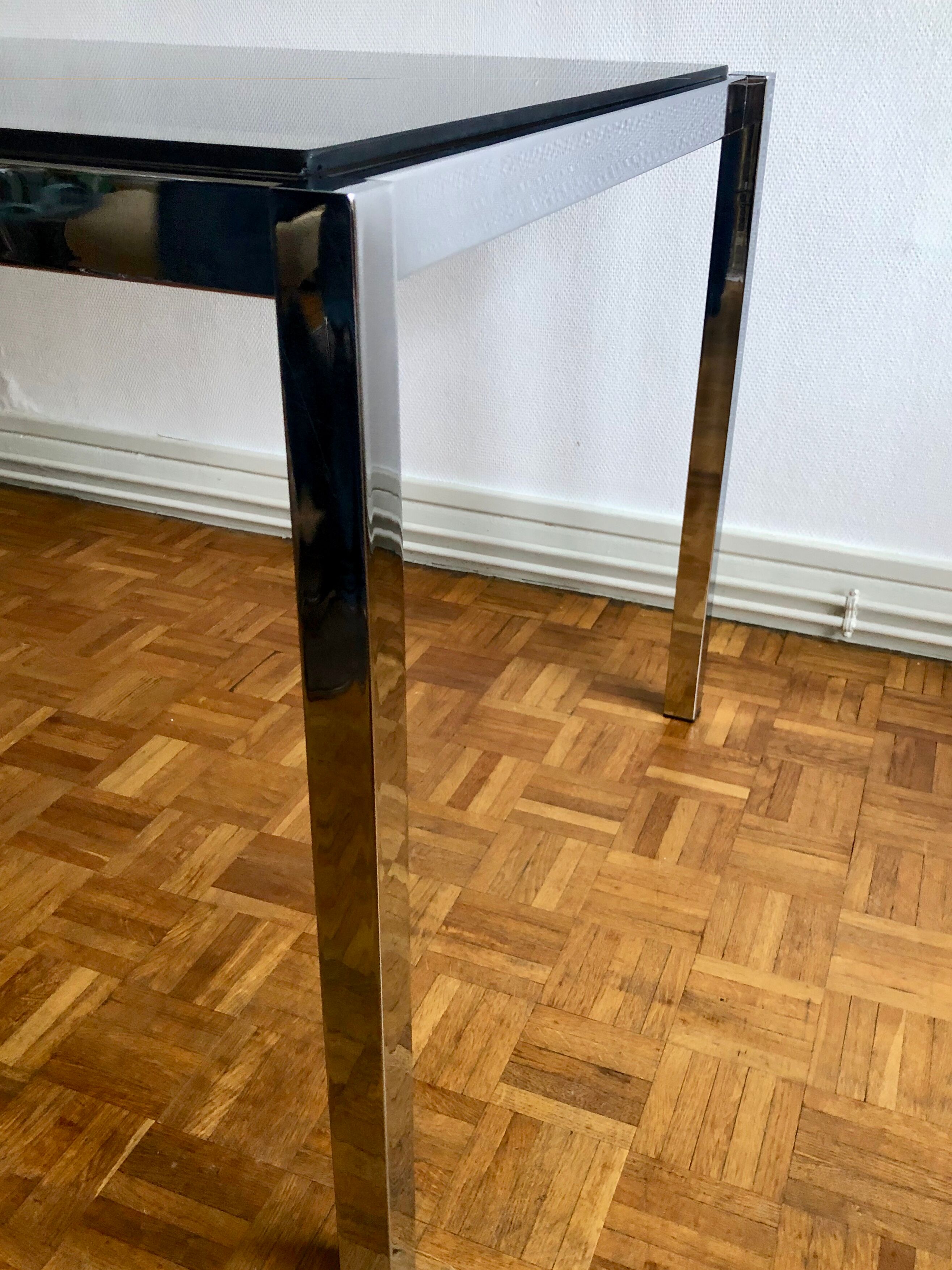 Glass and chrome metal dining table