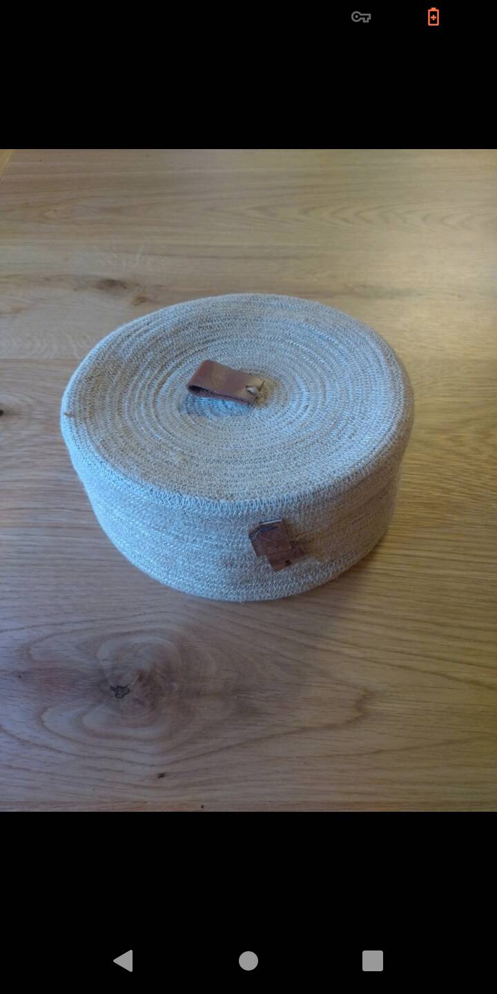 Basket with braided rope and leather lid