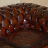 Pair of restored antique Chesterfield sofas in Boudreaux leather.