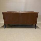 Scandinavian design 2-seater leather sofa.