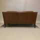 Scandinavian design 2-seater leather sofa.
