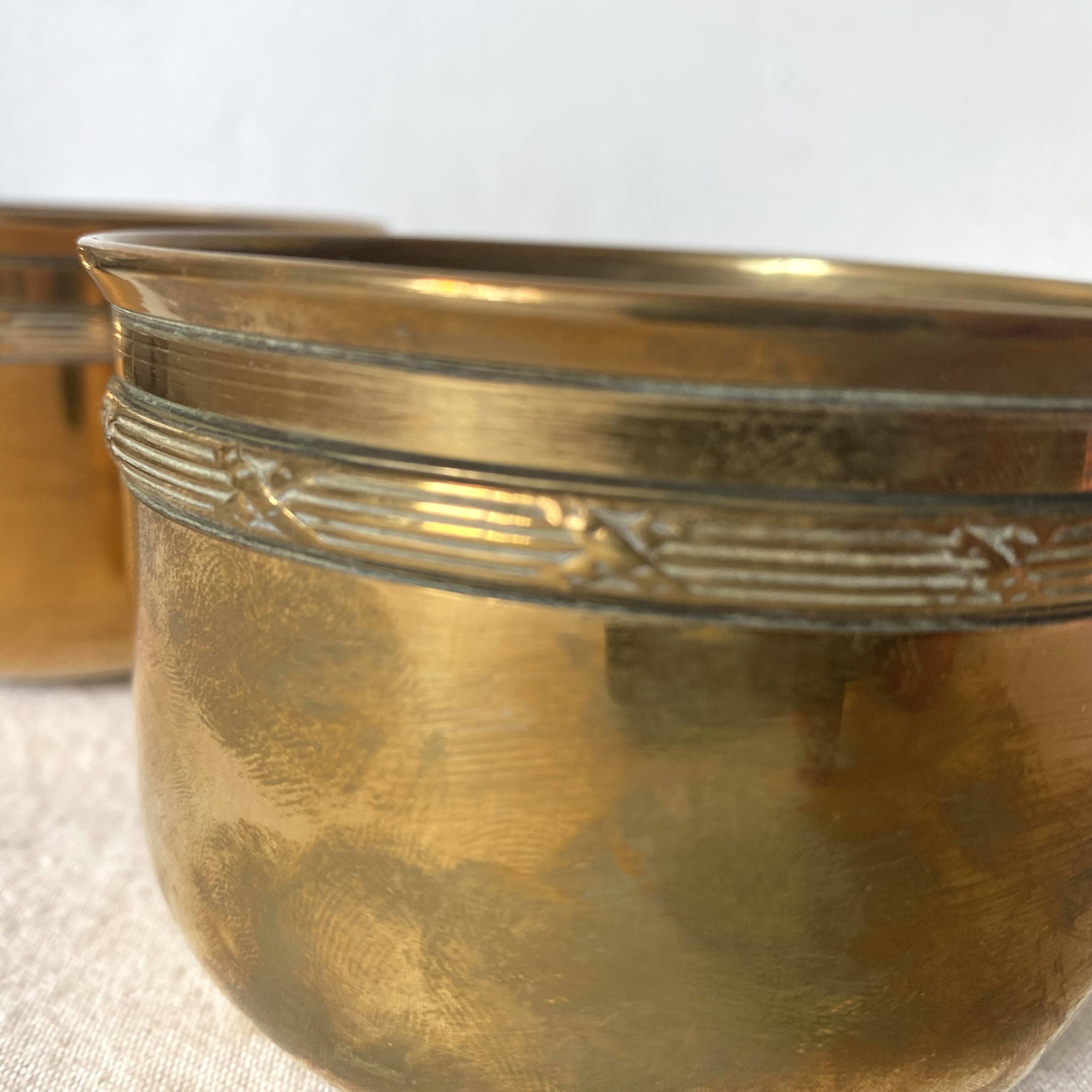 Antique brass cups