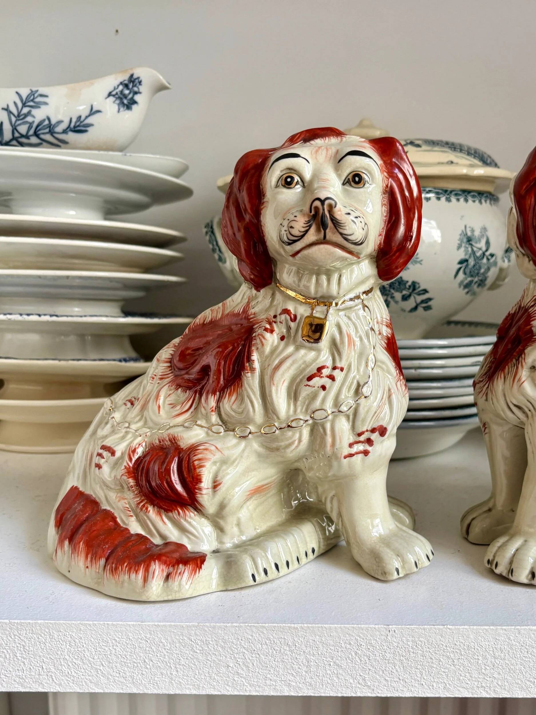 Pair of red Cavalier King Charles dogs in Staffordshire pottery, 19th century.