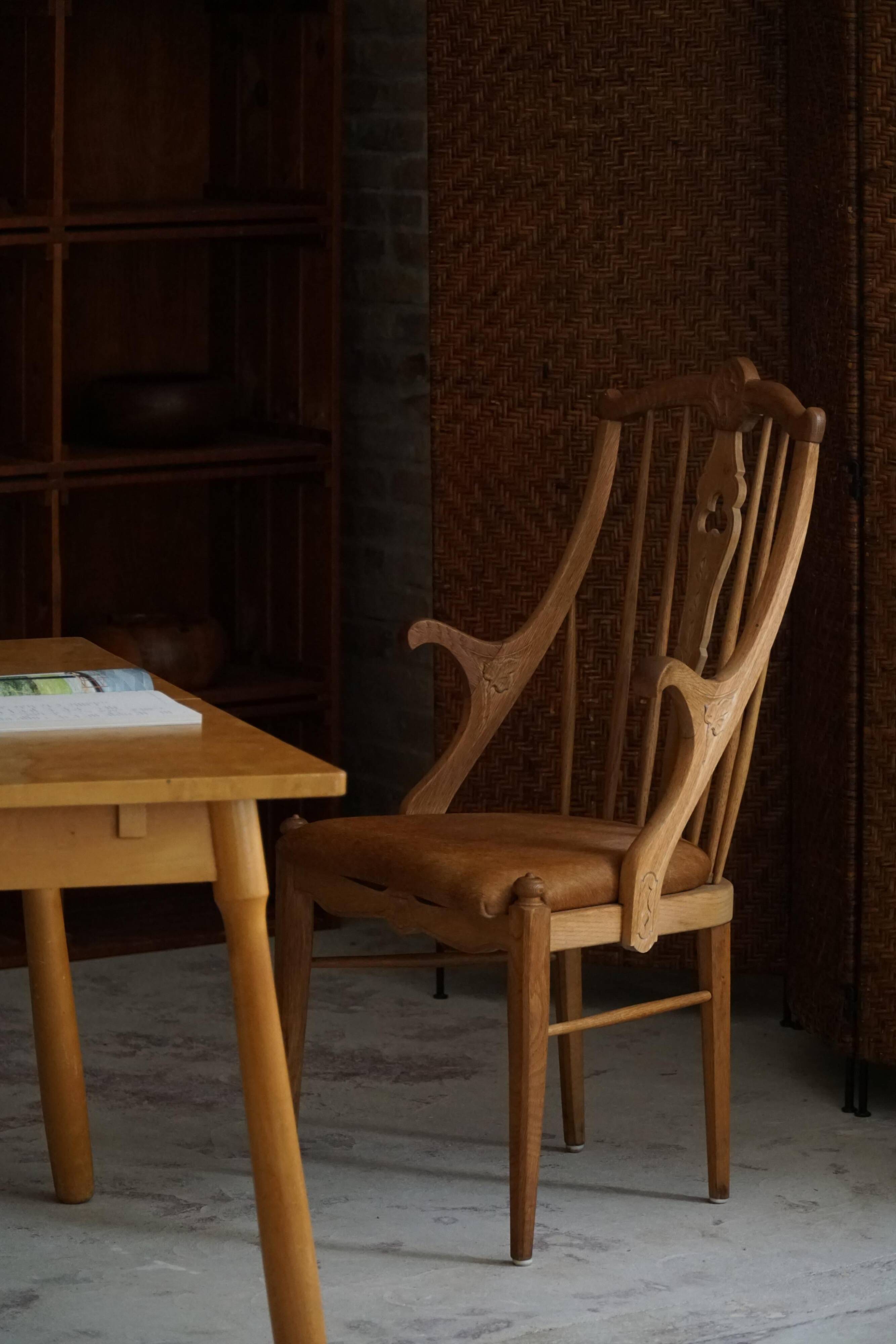 Danish high-back armchair in solid oak with leather cushion, mid-century, 1950s.