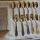 12 silver-plated metal teaspoons with a hallmark of 18.