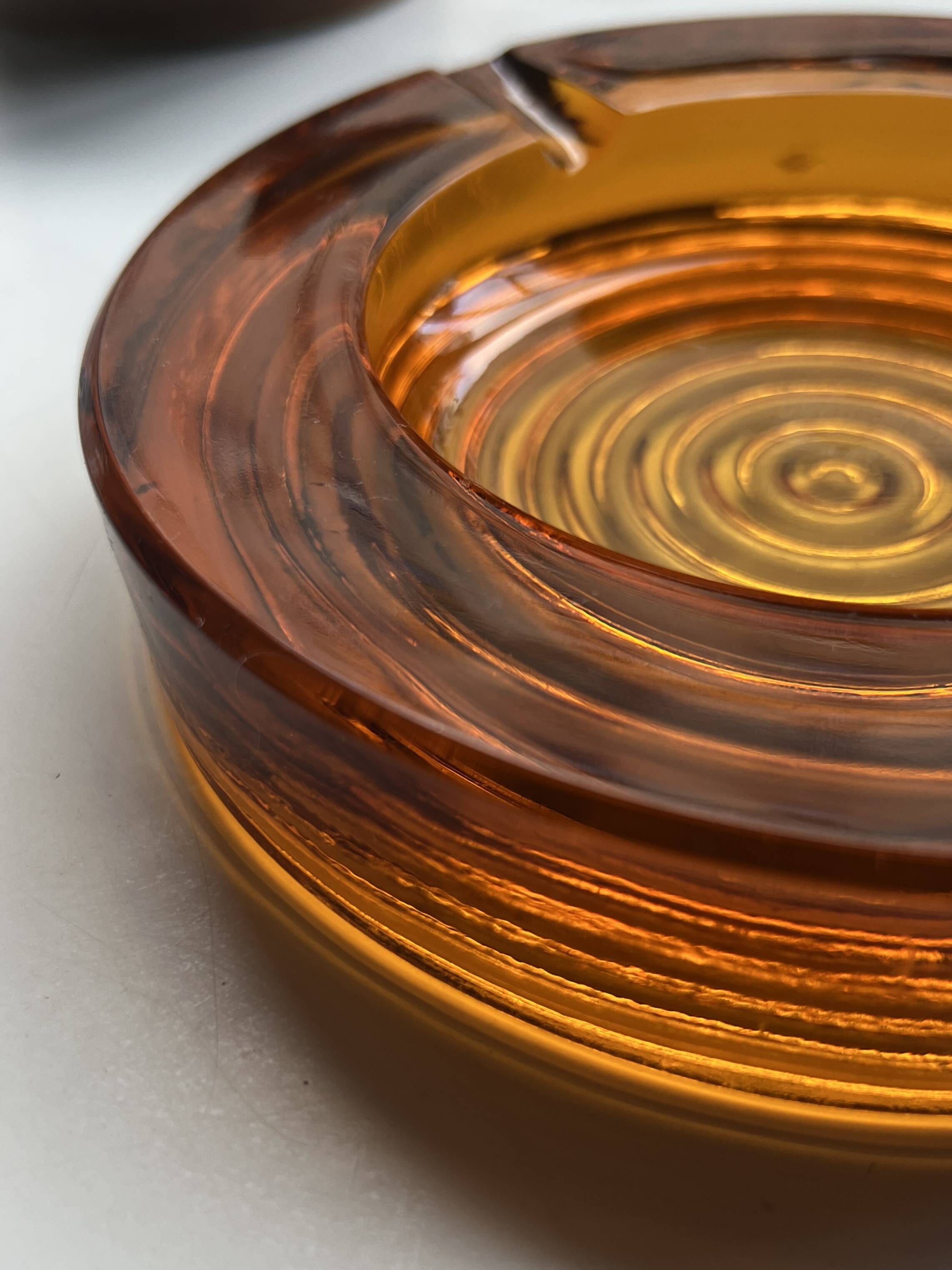 Amber pressed glass ashtray, 1970s design.