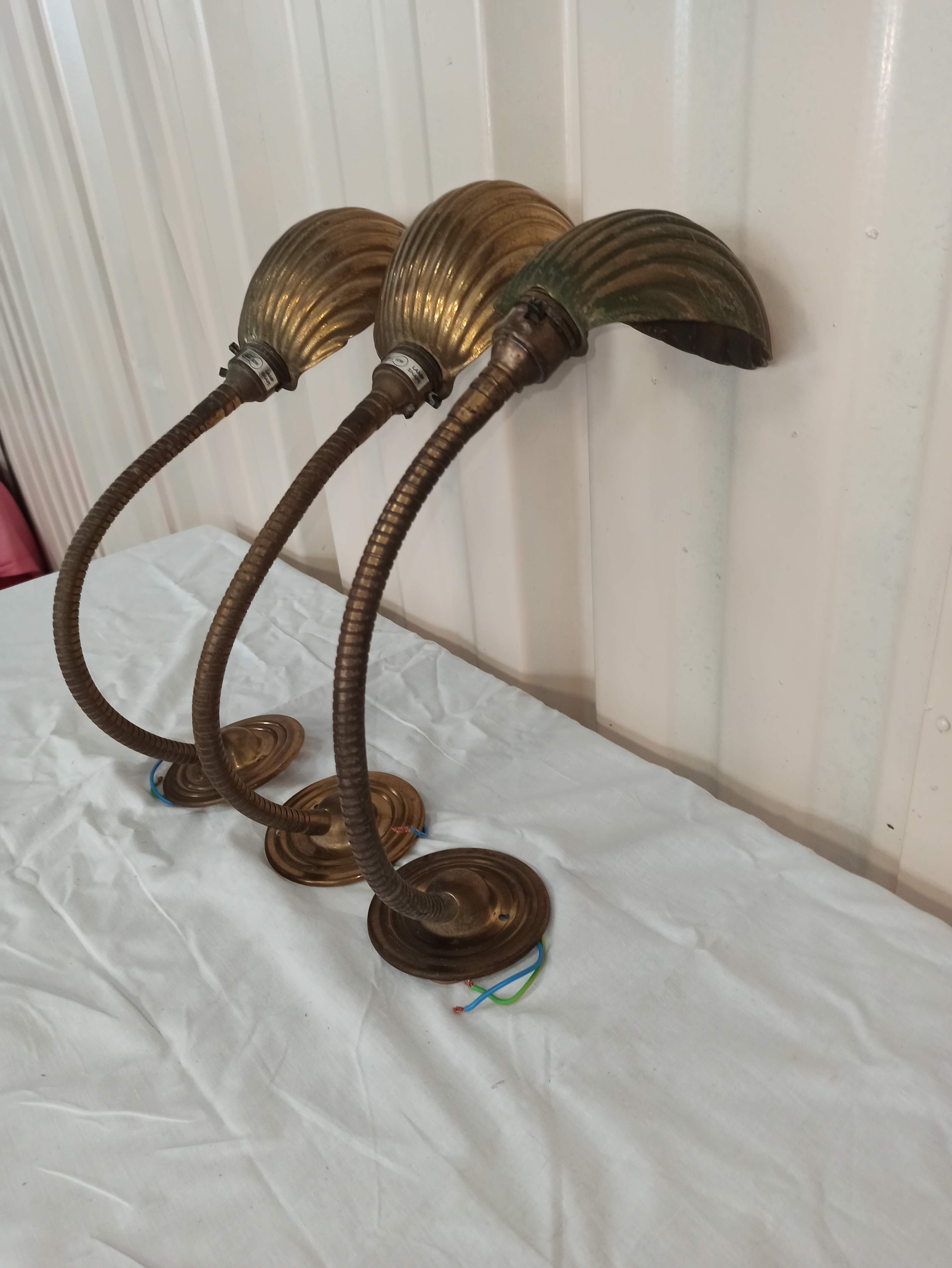 Trio of wall lamps Christopher Wray applies articulated lamp shell